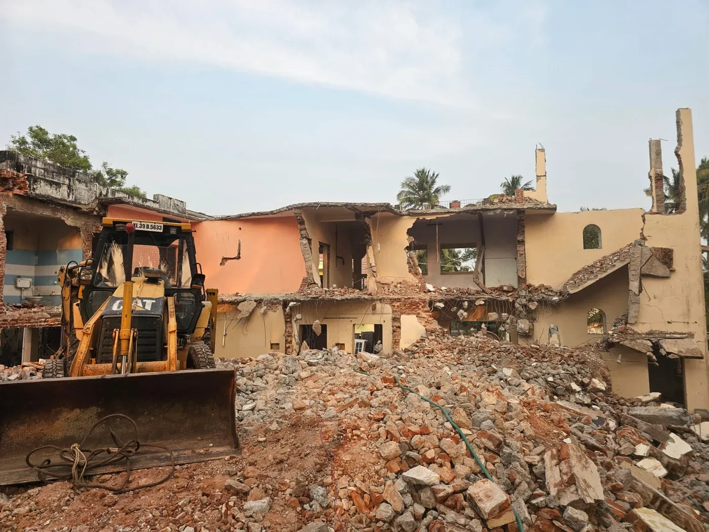 Broken masonry and rubble at a demolition site.