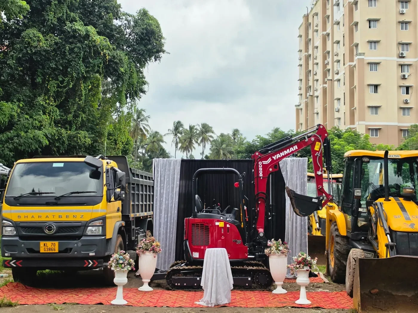 KJR tipper truck, mini excavator and backhoe loader together.